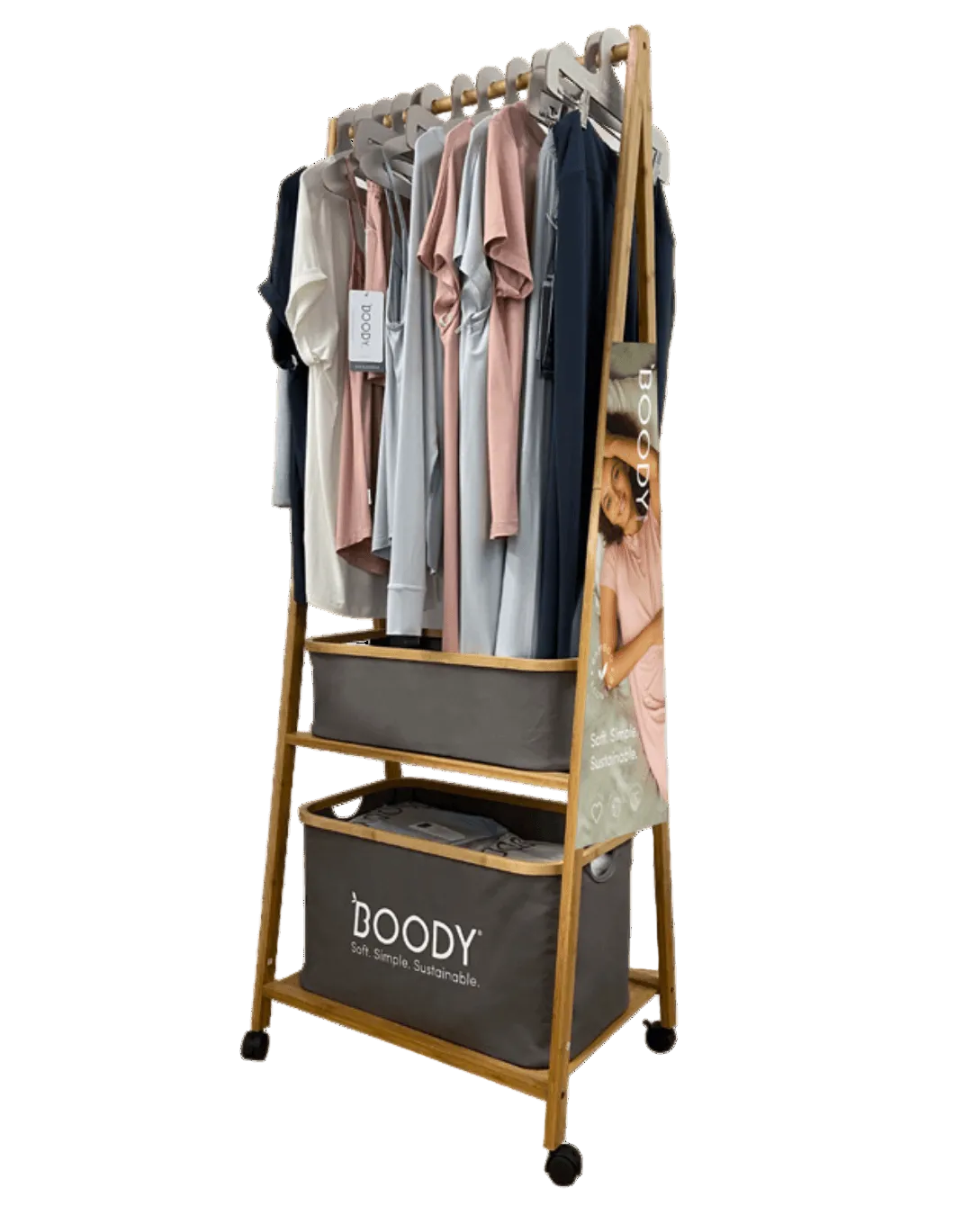Clothing rack with clothes and a Boody bag on a white background