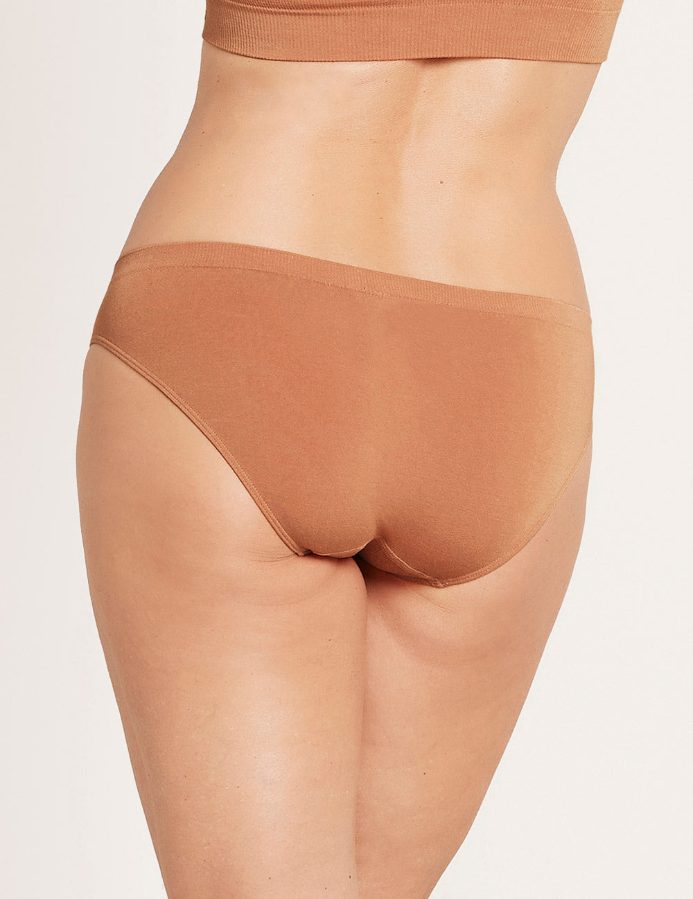 Brown underwear on a plain background