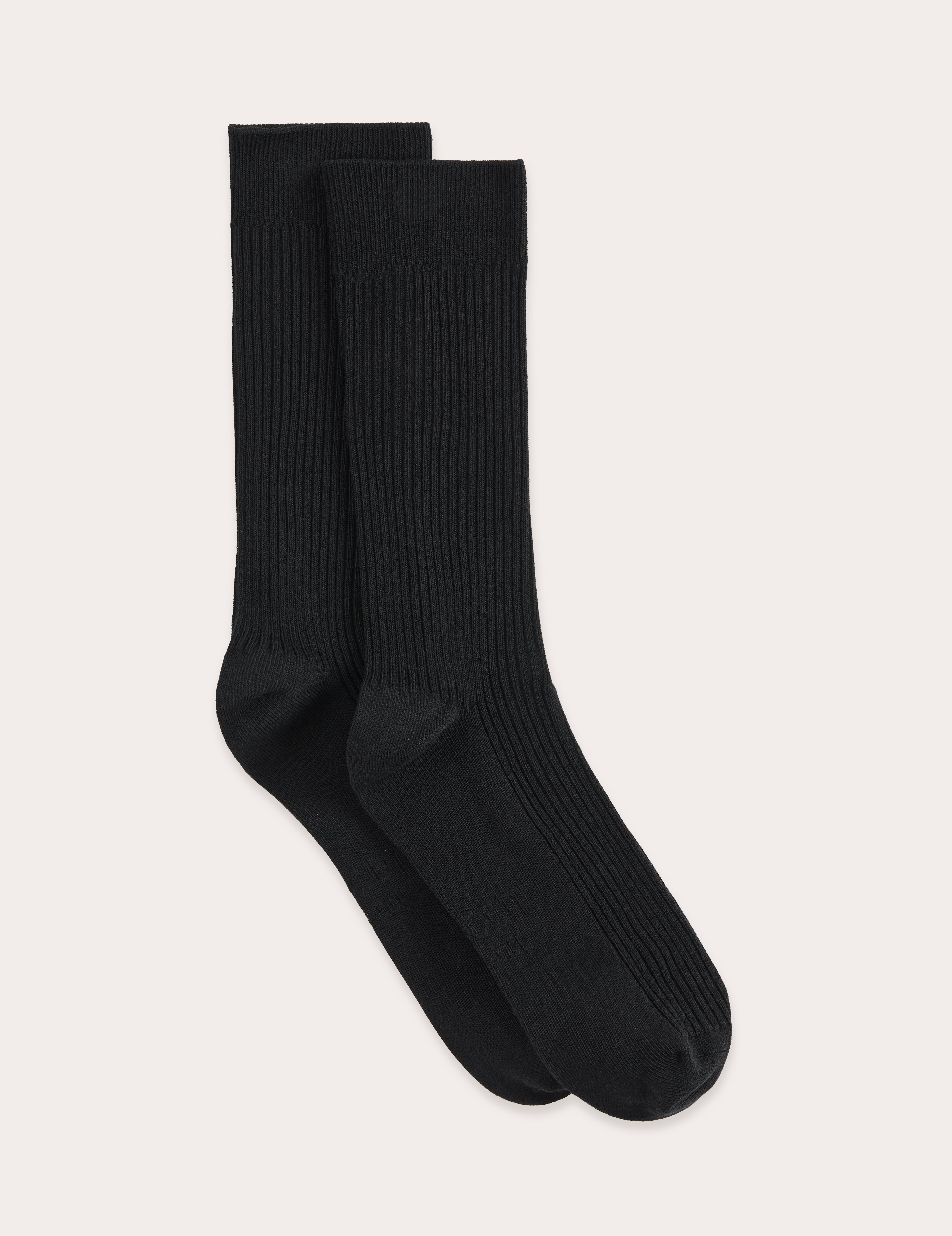 Pair of black socks on a light gray background
