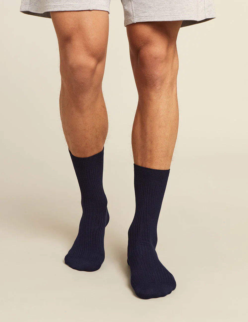 Navy socks worn with a neutral background